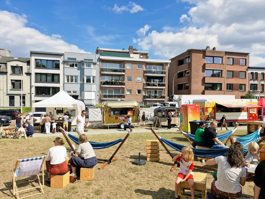 Food truck event on a square with hammocks, deckchairs and people enjoying the sun